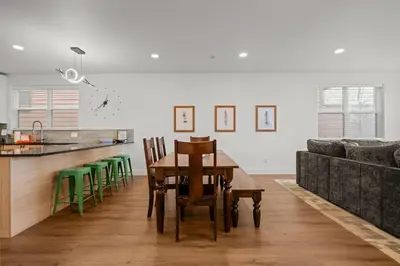 a kitchen with a table and chairs and a couch at 539 Granite St in Frisco