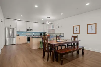 a kitchen with a wooden table and chairs in it at 539 Granite St in Frisco