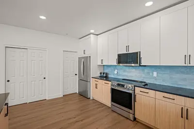 a kitchen with white cabinets and a stove top oven at 539 Granite St in Frisco