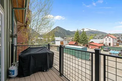 a balcony with a black tarp on a fence at 539 Granite St in Frisco