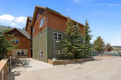 a large green building with a table and chairs at 539 Granite St in Frisco