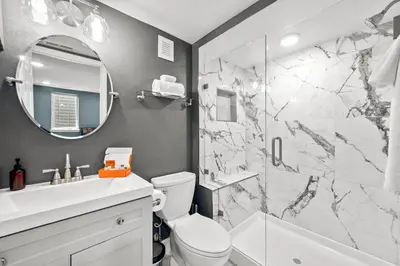 a bathroom with a sink toilet and a shower at 5632 Field St in Arvada