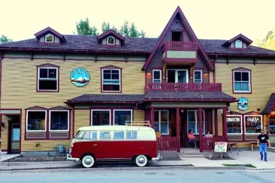 a red and white van parked in front of a building at Clear Creek Inn in Georgetown