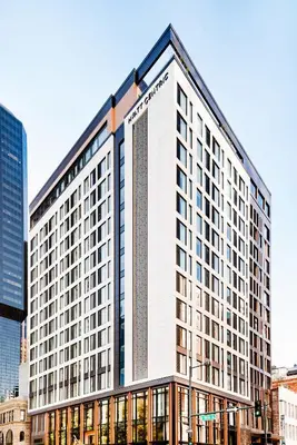 a tall white building with many windows at Hyatt Centric Downtown Denver in Denver