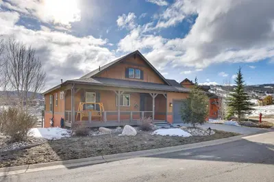 a large house with snow on the ground at Spacious Granby Home with Views Less Than 2 Mi to Ski and Golf in Granby