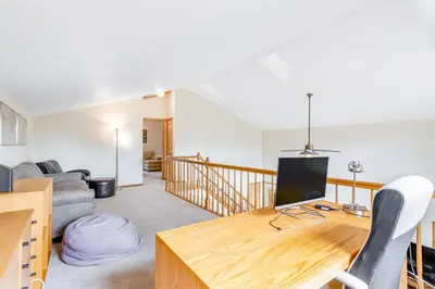 a living room with a table and a couch at Mountain Vistas in Silverthorne