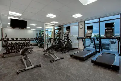 a gym with several treadmills and cardio equipment in it at Fairfield by Marriott Inn & Suites Denver Southwest, Littleton in Littleton
