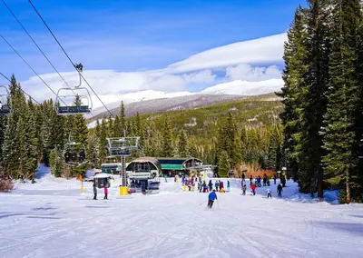 a group of people on a ski slope with a ski lift at Cozens Pointe I-101 condo in Fraser