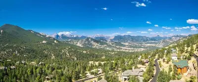 an aerial view of a mountain valley with trees at Azure Vista Vacation Home at Windcliff home in Estes Park