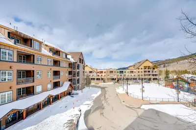 a resort in the snow with a playground at Ski-InandOut Condo with Hot Tub Access in Keystone! in Keystone