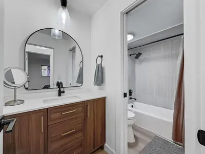 a bathroom with a sink and a toilet and a mirror at A304 Lake Cliffe condo in Dillon