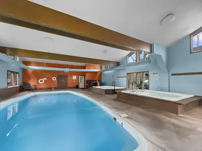 a large swimming pool in a building with a bath tub at A304 Lake Cliffe condo in Dillon