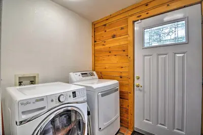 a laundry room with a washer and dryer at The Pinecone Palace with Hiking Trail Access! in Lyons
