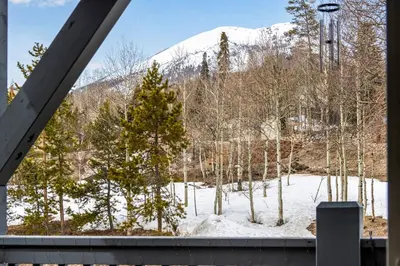 a view of a snow covered mountain from a house at Sunshine & Snowfall in Silverthorne