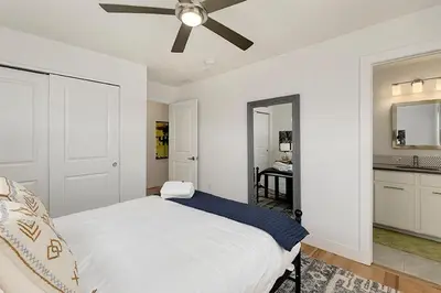 a bedroom with a bed and a ceiling fan at Gorgeous Townhome Steps from the Brewery District! in Fort Collins