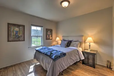 a bedroom with a large bed and a window at On-Site Hiking Access Mtn-View Conifer Cabin in Conifer