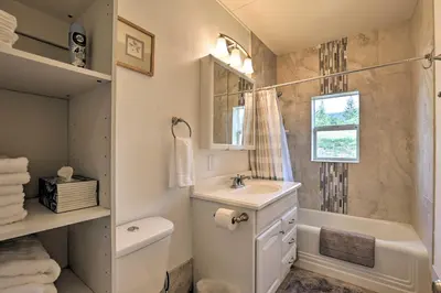 a bathroom with a sink and a tub and a toilet at On-Site Hiking Access Mtn-View Conifer Cabin in Conifer