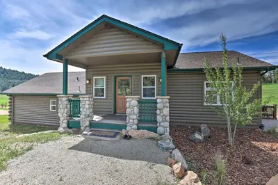 a small brown house with a tree in front of it at On-Site Hiking Access Mtn-View Conifer Cabin in Conifer