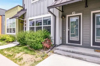 a house with a front door and a sidewalk at Spectacular Home near Breweries & River District! in Fort Collins