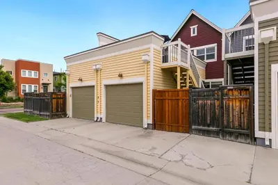 a house with a gate and a garage at Hip Old Town North Gem! Near Breweries and River! in Fort Collins