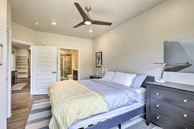 a bedroom with a bed and a ceiling fan at Walk to Lifts Condo with Mtn Views in Keystone! in Keystone