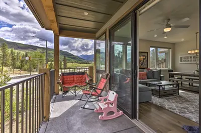 a screened in porch with a view of the mountains at Walk to Lifts Condo with Mtn Views in Keystone! in Keystone