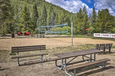 a park with two benches and a volley ball hoop at Walk to Lifts Condo with Mtn Views in Keystone! in Keystone