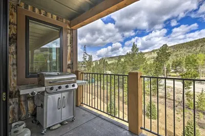 a grill on a balcony with a view of the mountains at Walk to Lifts Condo with Mtn Views in Keystone! in Keystone
