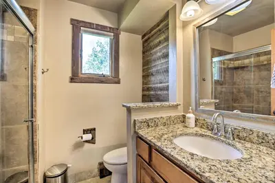 a bathroom with a sink and a toilet at 3-Story Home with Balcony about 6 Mi to Winter Park! in Fraser