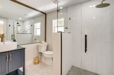 a bathroom with a toilet and a sink and a shower at Luxury Keystone Cabin with Hot Tub, 1 Mi to Lifts! in Keystone