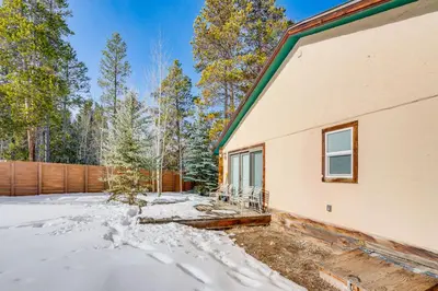 a house in the snow with a fence at Luxury Keystone Cabin with Hot Tub, 1 Mi to Lifts! in Keystone