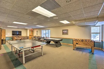 a ping pong room with ping pong tables at Cozy Ski-InandOut Winter Park Studio with Hot Tubs! in Winter Park
