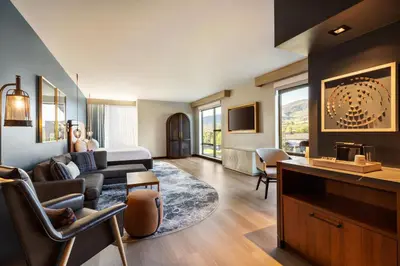 a living room with a couch and a table at Hotel Indigo - Silverthorne by IHG in Silverthorne