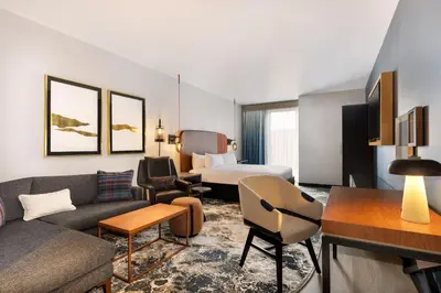 a hotel room with a couch and a bed at Hotel Indigo - Silverthorne by IHG in Silverthorne