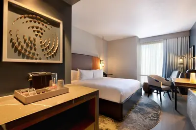 a hotel room with a bed and a desk at Hotel Indigo - Silverthorne by IHG in Silverthorne