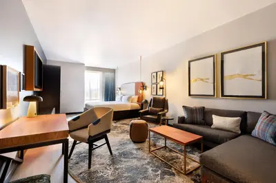 a living room with a couch and a bed at Hotel Indigo - Silverthorne by IHG in Silverthorne