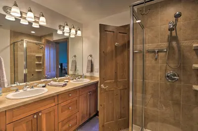 a bathroom with two sinks and a shower at Private Hot Tub Family Townhome in Breckenridge in Breckenridge