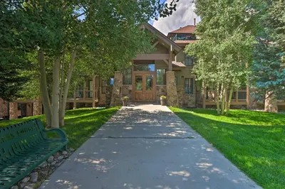 a walkway in front of a house with a bench at 5 Mi to Ski Resort Breck Penthouse Studio in Breckenridge