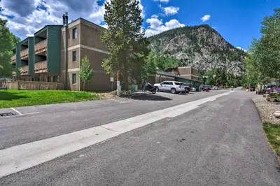 an empty street with a building and a mountain at Frisco Condo 2 Blocks to Main St Year-Round Fun! in Frisco