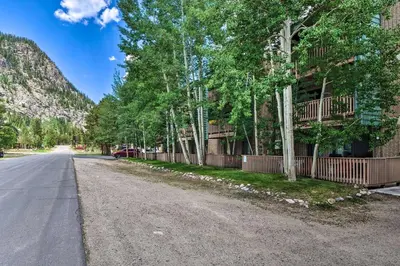 an empty street with trees and a building at Frisco Condo 2 Blocks to Main St Year-Round Fun! in Frisco