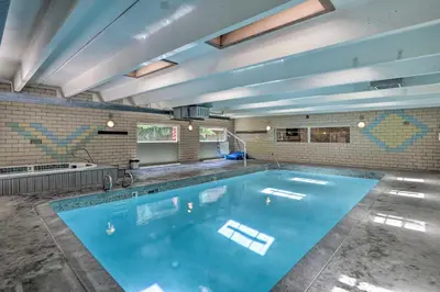 a large swimming pool in the middle of a room at Frisco Condo 2 Blocks to Main St Year-Round Fun! in Frisco