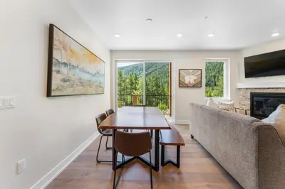 a living room with a table and a couch at Clearwater Lofts 107 Building 3 in Keystone