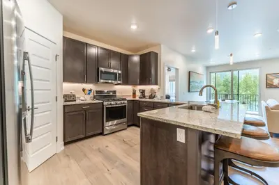 a kitchen with wooden cabinets and a counter top at Clearwater Lofts 107 Building 3 in Keystone
