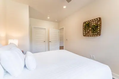 a bedroom with a white bed with white pillows at Clearwater Lofts 107 Building 3 in Keystone