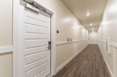 a hallway with white cabinets and a door at Clearwater Lofts 107 Building 3 in Keystone