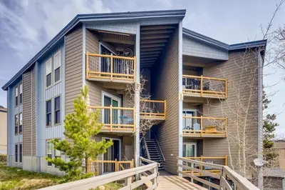a apartment building with balconies and a staircase at F201 Treehouse condo in Silverthorne