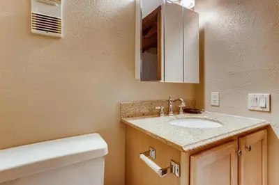 a bathroom with a sink and a toilet at F201 Treehouse condo in Silverthorne