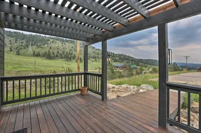 a wooden deck with a view of a mountain at Modern Evergreen Duplex Off I-70 with Mountain Views in Idaho Springs