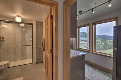 a bathroom with a shower and a toilet and a sink at Modern Evergreen Duplex Off I-70 with Mountain Views in Idaho Springs