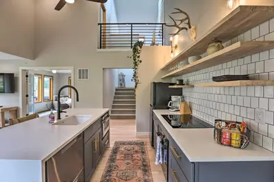 a kitchen with a sink and a counter top at Evergreen Mountain Duplex with Trail Access! in Idaho Springs